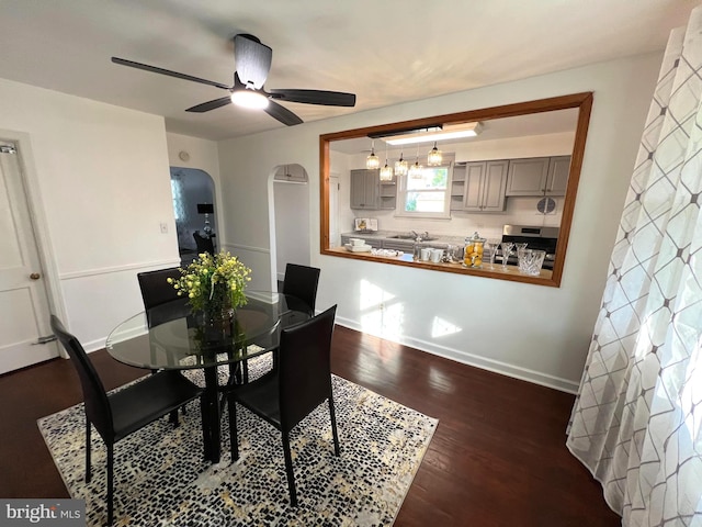 600 W 32nd St, Wilmington, DE 19802 - dining space featuring wood finished floors, a ceiling fan, and arched walkways
