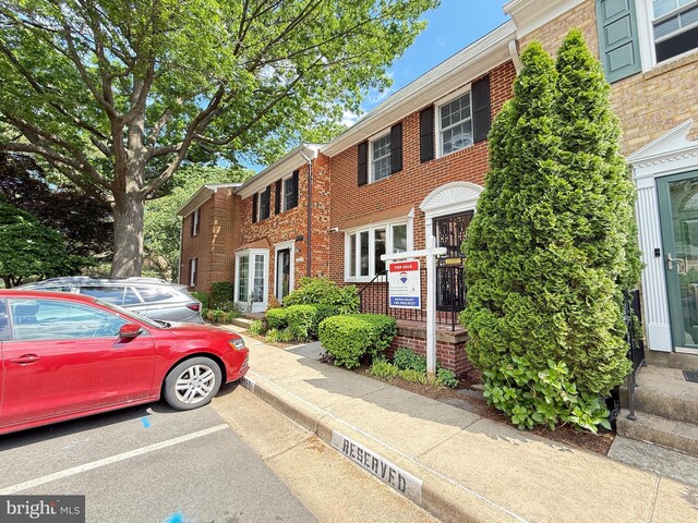 2649 Centennial Ct, Alexandria, VA 22311 - view of front facade featuring brick siding, entry steps, and uncovered parking