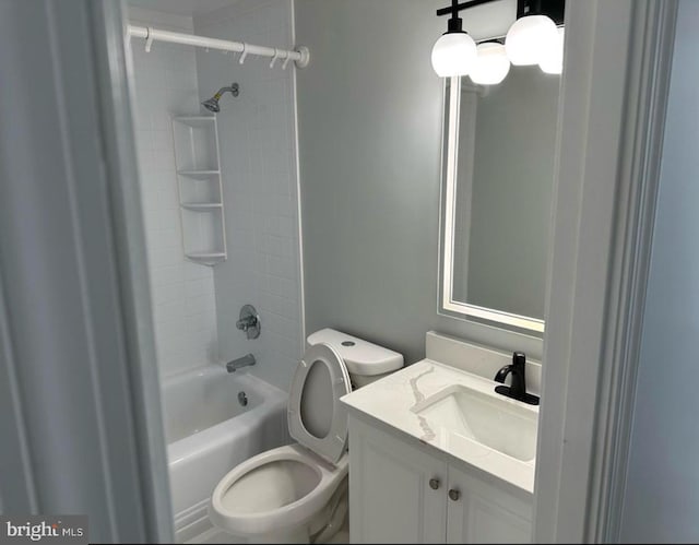 bathroom with toilet, vanity, and shower / tub combination