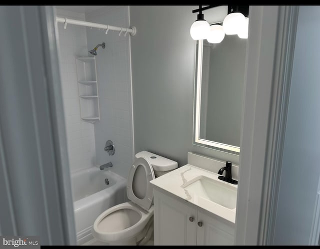 bathroom with vanity, toilet, and washtub / shower combination