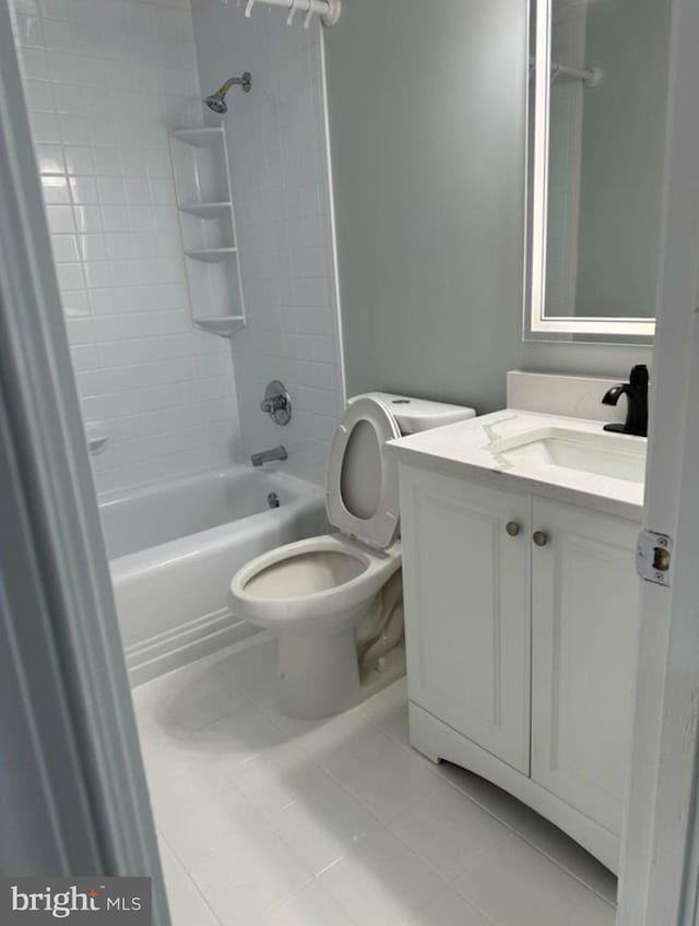 full bath with toilet, tile patterned flooring, bathing tub / shower combination, and vanity