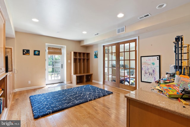foyer entrance with french doors, light wood-type flooring, recessed lighting, and baseboards