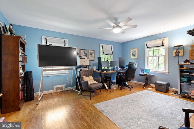 home office with ceiling fan, wood finished floors, and baseboards