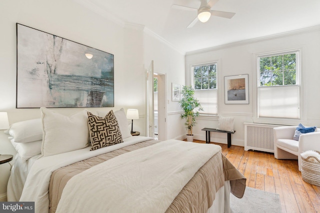 3309 Q St NW, Washington, DC 20007 - bedroom with ornamental molding, radiator, light wood finished floors, a ceiling fan, and baseboards
