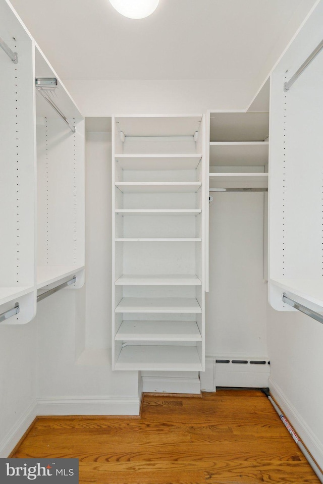 3309 Q St NW, Washington, DC 20007 - walk in closet with wood finished floors and baseboard heating