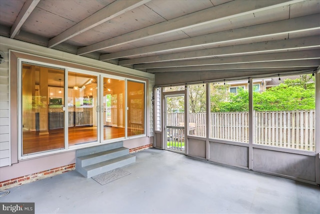 unfurnished sunroom featuring entry steps