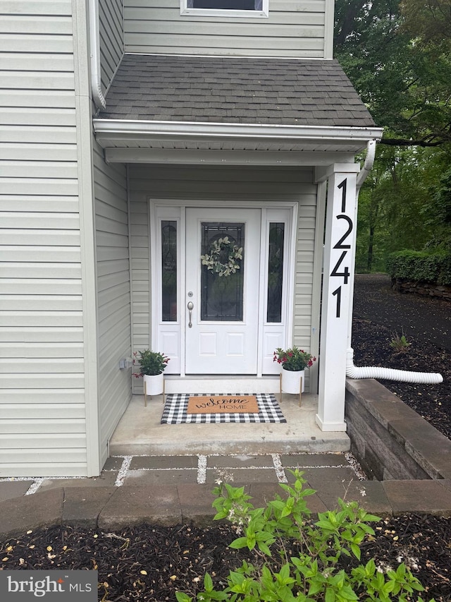 1241 Ridge Rd, Feasterville Trevose, PA 19053 - doorway to property featuring roof with shingles