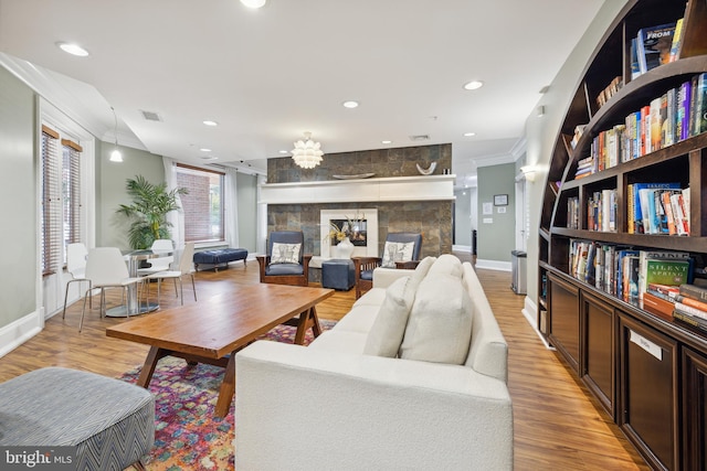 23 Arch Pl Unit 475, Gaithersburg, MD 20878 - living room with baseboards, recessed lighting, crown molding, light wood-style flooring, and a large fireplace