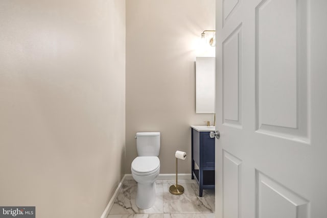 23 Arch Pl Unit 475, Gaithersburg, MD 20878 - half bath featuring vanity, marble finish floors, toilet, and baseboards