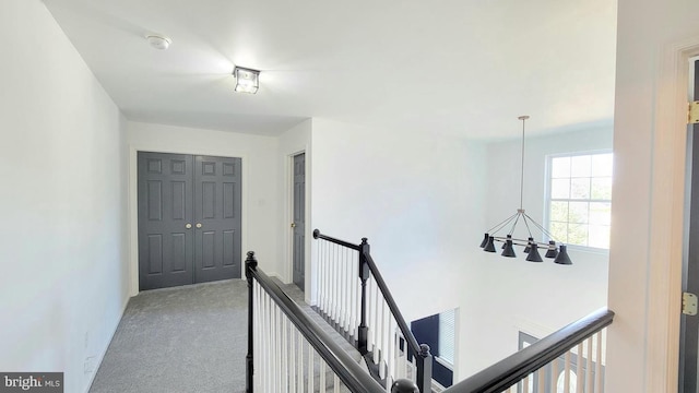 4 Elma Ave, Burlington, NJ 08016 - corridor featuring an upstairs landing, carpet flooring, and a chandelier