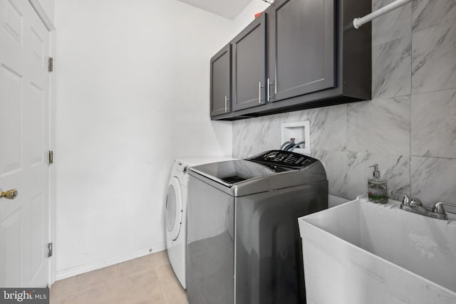 4 Elma Ave, Burlington, NJ 08016 - washroom featuring cabinet space, light tile patterned floors, baseboards, and washer and dryer