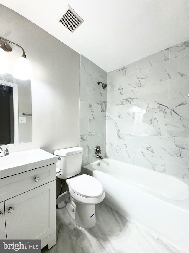 bathroom featuring toilet, marble finish floor, vanity, visible vents, and bathing tub / shower combination