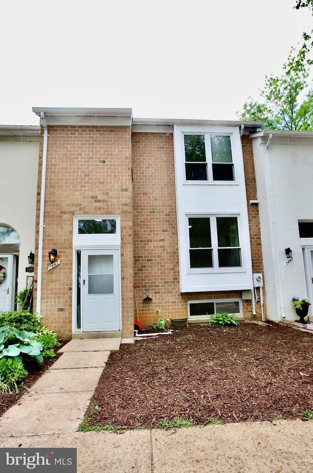 view of front of property featuring brick siding