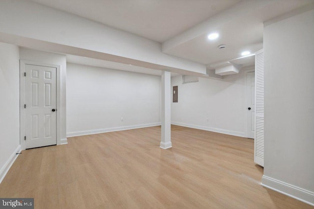 7813 Main Falls Cir, Baltimore, MD 21228 - finished basement featuring light wood-type flooring, baseboards, recessed lighting, and electric panel