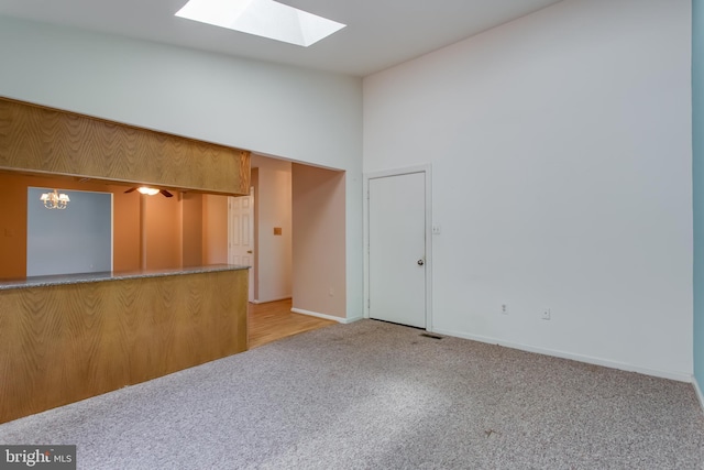 10703 Moray Ct, Cheltenham, MD 20623 - unfurnished room with a skylight, light carpet, baseboards, and a chandelier