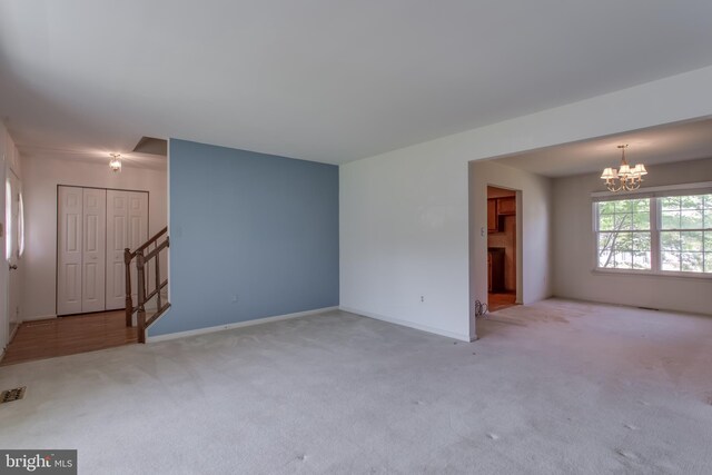 10703 Moray Ct, Cheltenham, MD 20623 - unfurnished living room featuring a chandelier, carpet floors, stairway, and baseboards
