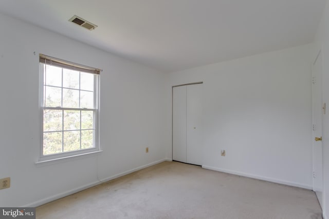10703 Moray Ct, Cheltenham, MD 20623 - spare room featuring healthy amount of natural light, light carpet, and baseboards