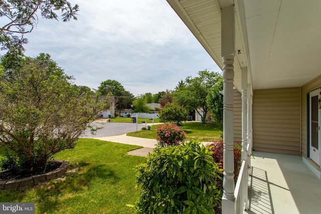10703 Moray Ct, Cheltenham, MD 20623 - view of green lawn featuring a porch