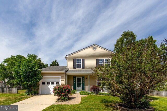 10703 Moray Ct, Cheltenham, MD 20623 - traditional-style house featuring a garage, driveway, and a porch