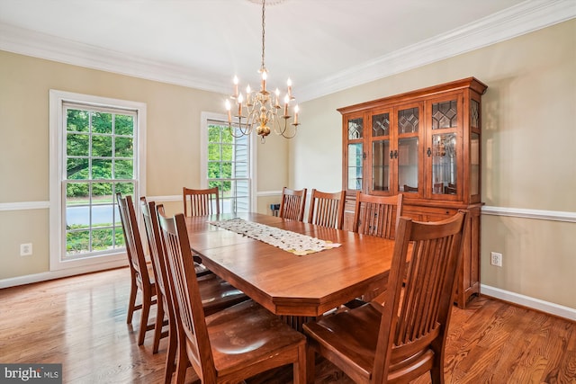 12630 Garry Glen Dr, Bristow, VA 20136 - dining area with a chandelier, light wood-style flooring, baseboards, and crown molding