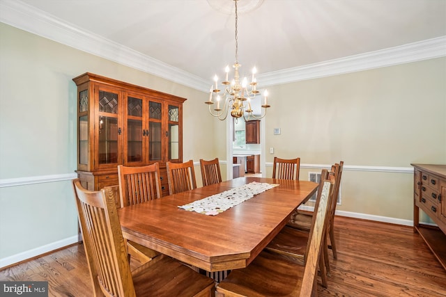 12630 Garry Glen Dr, Bristow, VA 20136 - dining area featuring a chandelier, wood finished floors, ornamental molding, and baseboards
