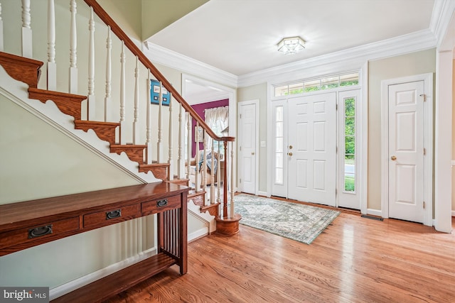 12630 Garry Glen Dr, Bristow, VA 20136 - entrance foyer featuring stairs, wood finished floors, ornamental molding, and baseboards