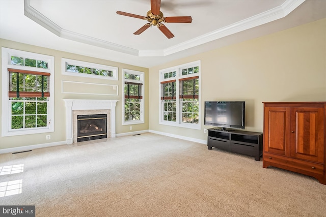 12630 Garry Glen Dr, Bristow, VA 20136 - living room featuring a raised ceiling, light carpet, ornamental molding, and healthy amount of natural light