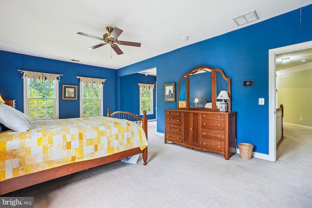 12630 Garry Glen Dr, Bristow, VA 20136 - carpeted bedroom featuring multiple windows, baseboards, and a ceiling fan