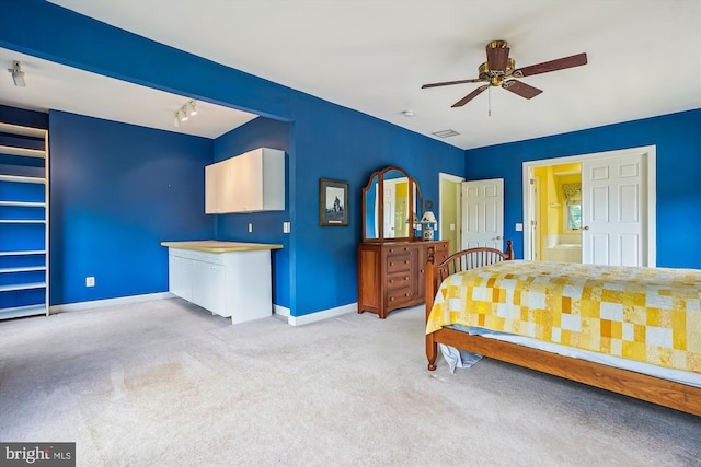 12630 Garry Glen Dr, Bristow, VA 20136 - bedroom with baseboards, light carpet, and rail lighting