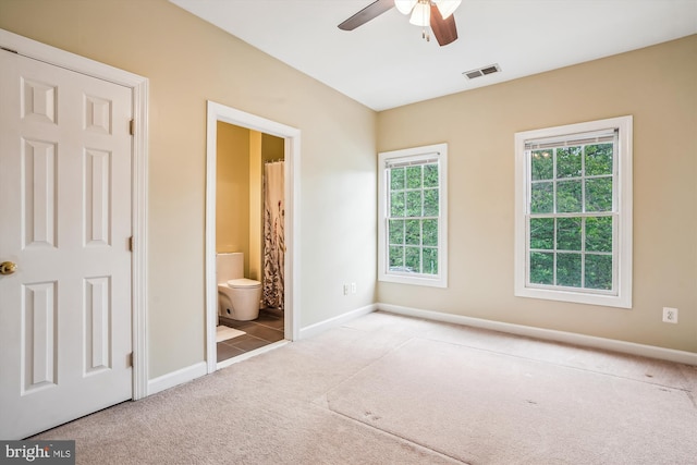12630 Garry Glen Dr, Bristow, VA 20136 - unfurnished bedroom with multiple windows, carpet flooring, baseboards, and ensuite bath