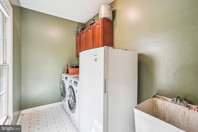 12630 Garry Glen Dr, Bristow, VA 20136 - laundry area with light floors, separate washer and dryer, and cabinet space