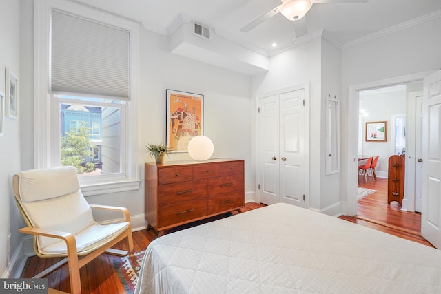 520 E Street Ne 105, Washington, DC 20002 - bedroom with ornamental molding, baseboards, a closet, and wood finished floors