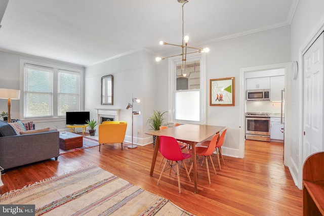 520 E Street Ne 105, Washington, DC 20002 - dining room with crown molding, light wood-style flooring, and baseboards