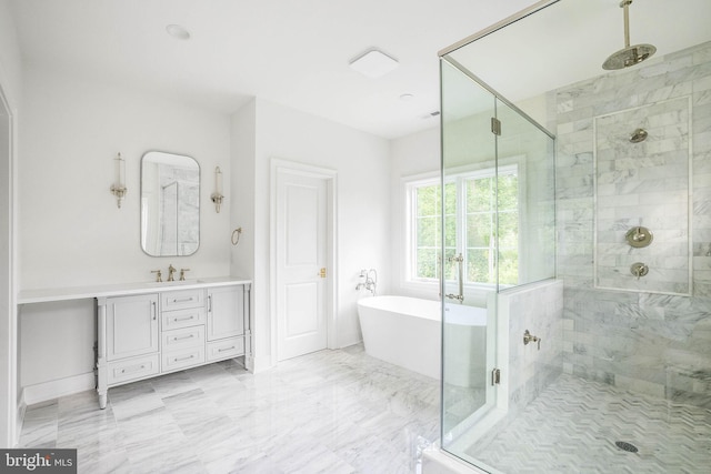 bathroom featuring a shower stall, a soaking tub, vanity, and marble finish flooring