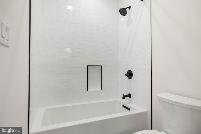 bathroom with toilet and shower / tub combination