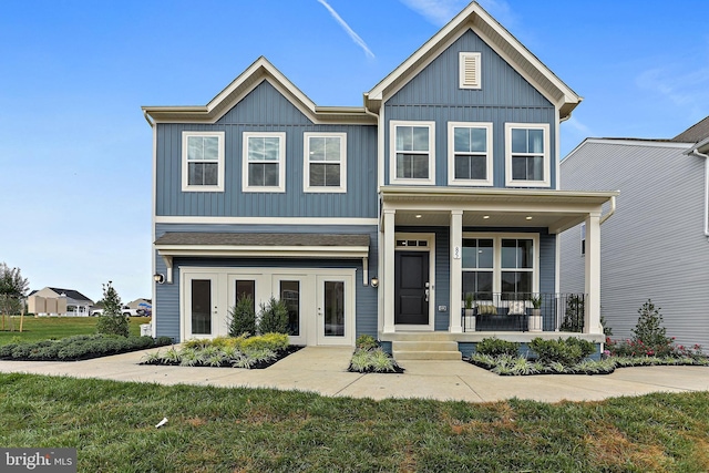 LOT484 Mountain Laurel Blvd Ashton, Unit Ashton, Ranson, WV 25438 - view of front facade featuring covered porch, board and batten siding, and a front yard