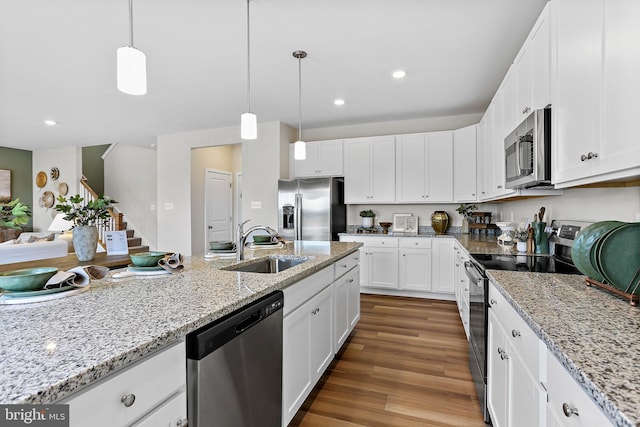 LOT484 Mountain Laurel Blvd Ashton, Unit Ashton, Ranson, WV 25438 - kitchen with a sink, stainless steel appliances, wood finished floors, pendant lighting, and white cabinetry