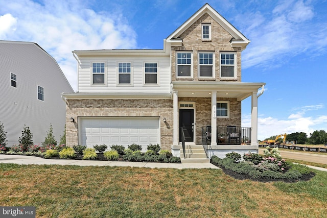 craftsman-style home with a front yard, brick siding, covered porch, and a garage