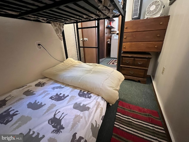 bedroom featuring carpet flooring and washer / clothes dryer