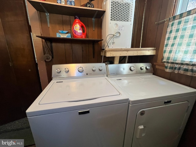 laundry area with washer and clothes dryer and laundry area