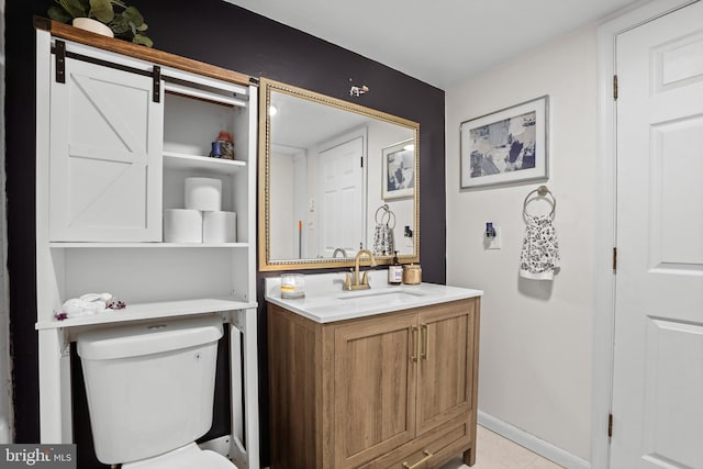 443 Deerwood Dr, Fredericksburg, VA 22401 - bathroom featuring toilet, vanity, and baseboards