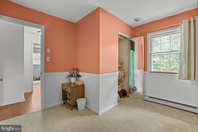 443 Deerwood Dr, Fredericksburg, VA 22401 - hallway with a baseboard heating unit, carpet, and baseboards