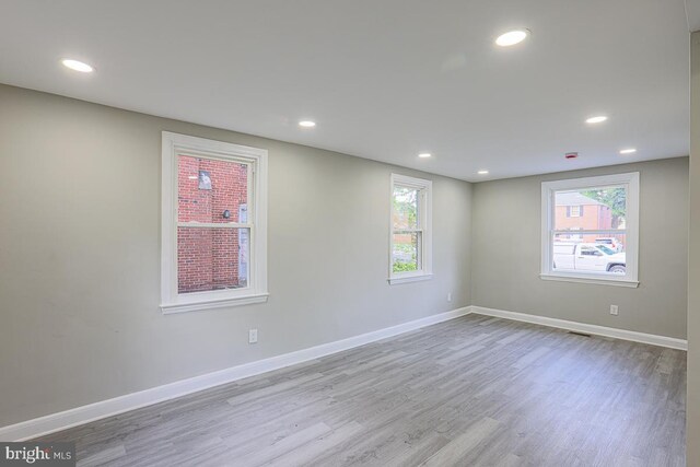 7004 Alden Rd, Pikesville, MD 21208 - empty room with wood finished floors, recessed lighting, baseboards, and plenty of natural light