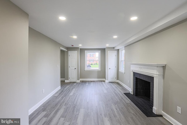 7004 Alden Rd, Pikesville, MD 21208 - unfurnished living room with wood finished floors, recessed lighting, a fireplace, and baseboards