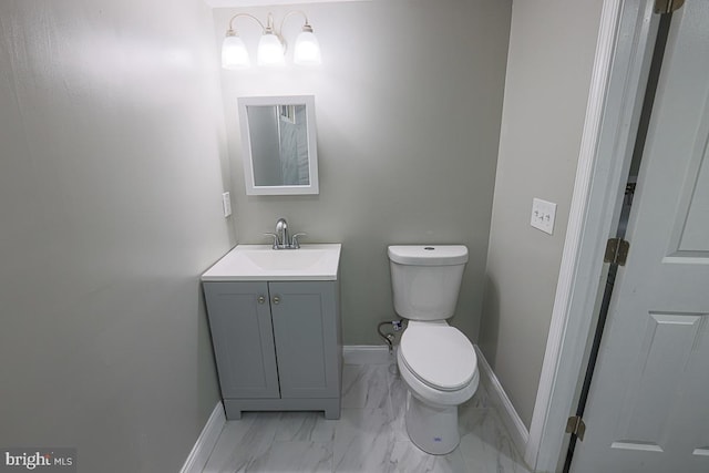 7004 Alden Rd, Pikesville, MD 21208 - half bath featuring toilet, vanity, marble finish flooring, and baseboards
