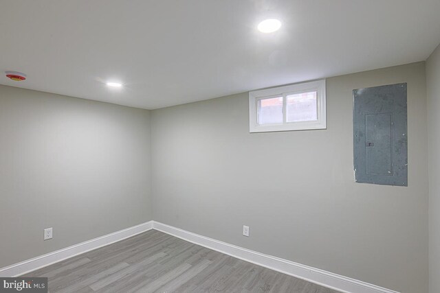 7004 Alden Rd, Pikesville, MD 21208 - basement featuring electric panel, wood finished floors, baseboards, and recessed lighting