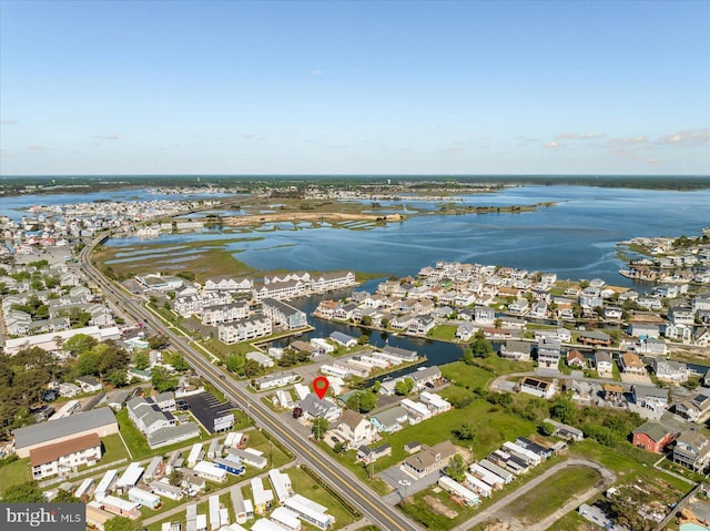 38967 Willow Ln, Fenwick Island, DE 19944 - aerial view of property and surrounding area featuring a large body of water and nearby suburban area