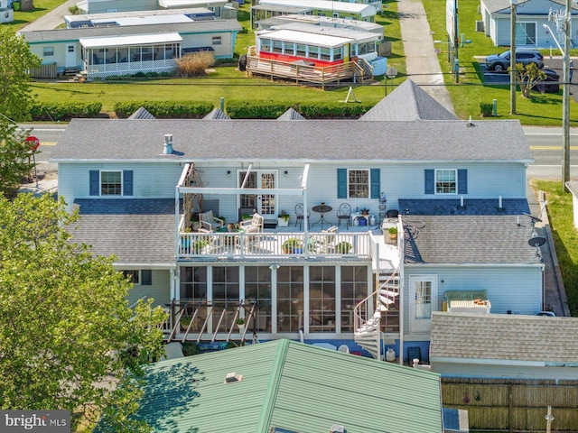 38967 Willow Ln, Fenwick Island, DE 19944 - back of property with a sunroom, roof with shingles, and a residential view