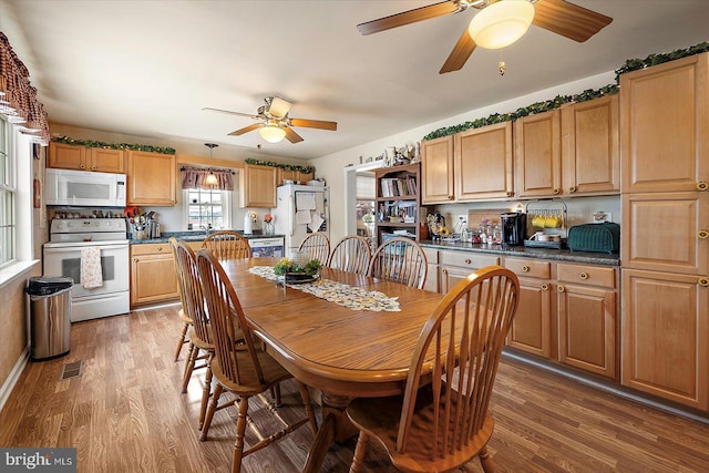 38967 Willow Ln, Fenwick Island, DE 19944 - dining space with a ceiling fan and light wood-style floors