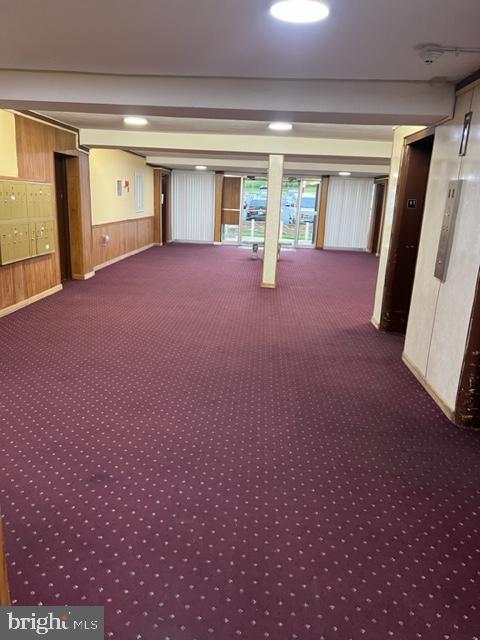 9250 Edwards Way Unit 101-A, Hyattsville, MD 20783 - interior space with wood walls and carpet floors